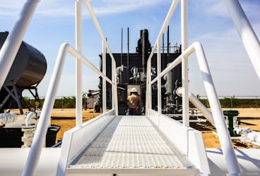 Archrock Employee Working on Equipment.