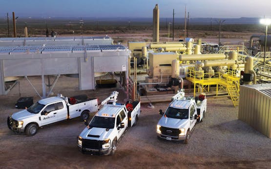 Archrock vehicles on job site.